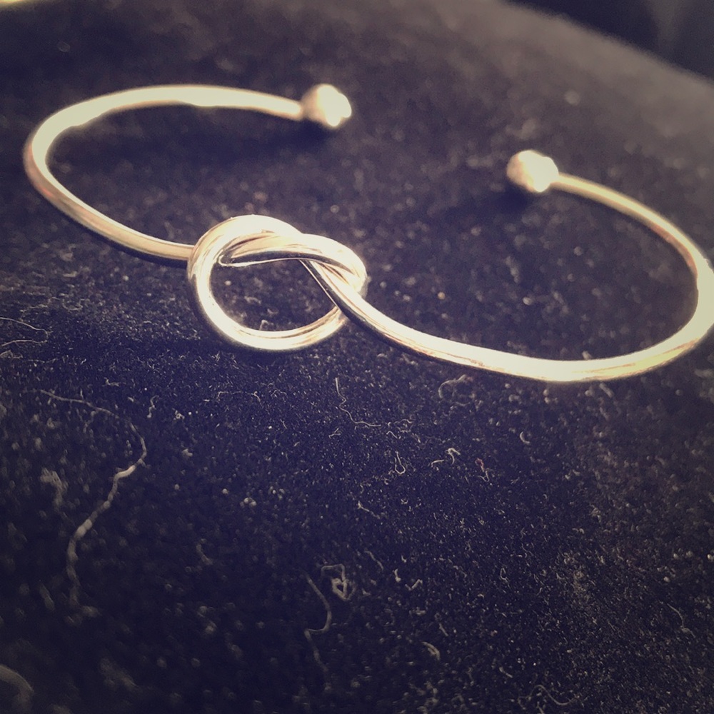 Silver tone knot bracelet